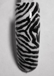 was a little bored today so i decided to try some zebra nail art